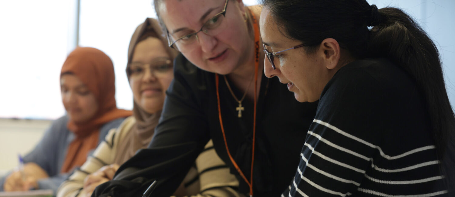 Students learning with teacher