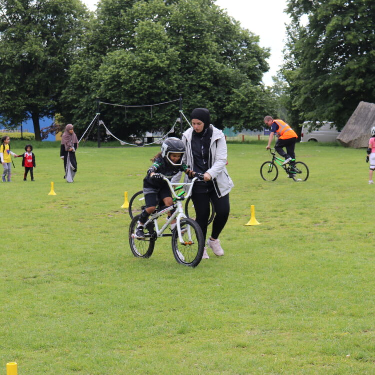 Young person learning to cycle